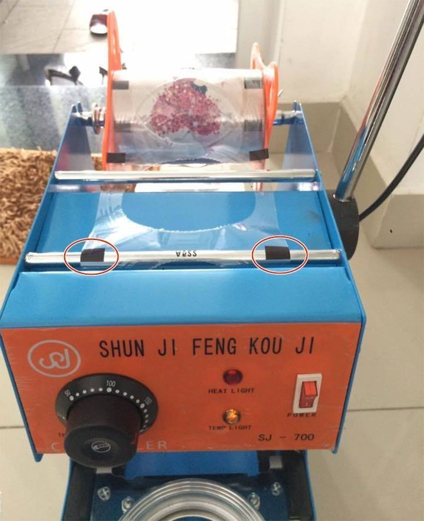Nơi để cuộn giấy dán của Máy ép miệng ly Shunji SJ-700